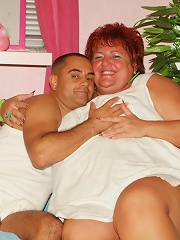 Fat redhead Mindy gets down on all fours to let a hunk pound her pussy hard doggy style live